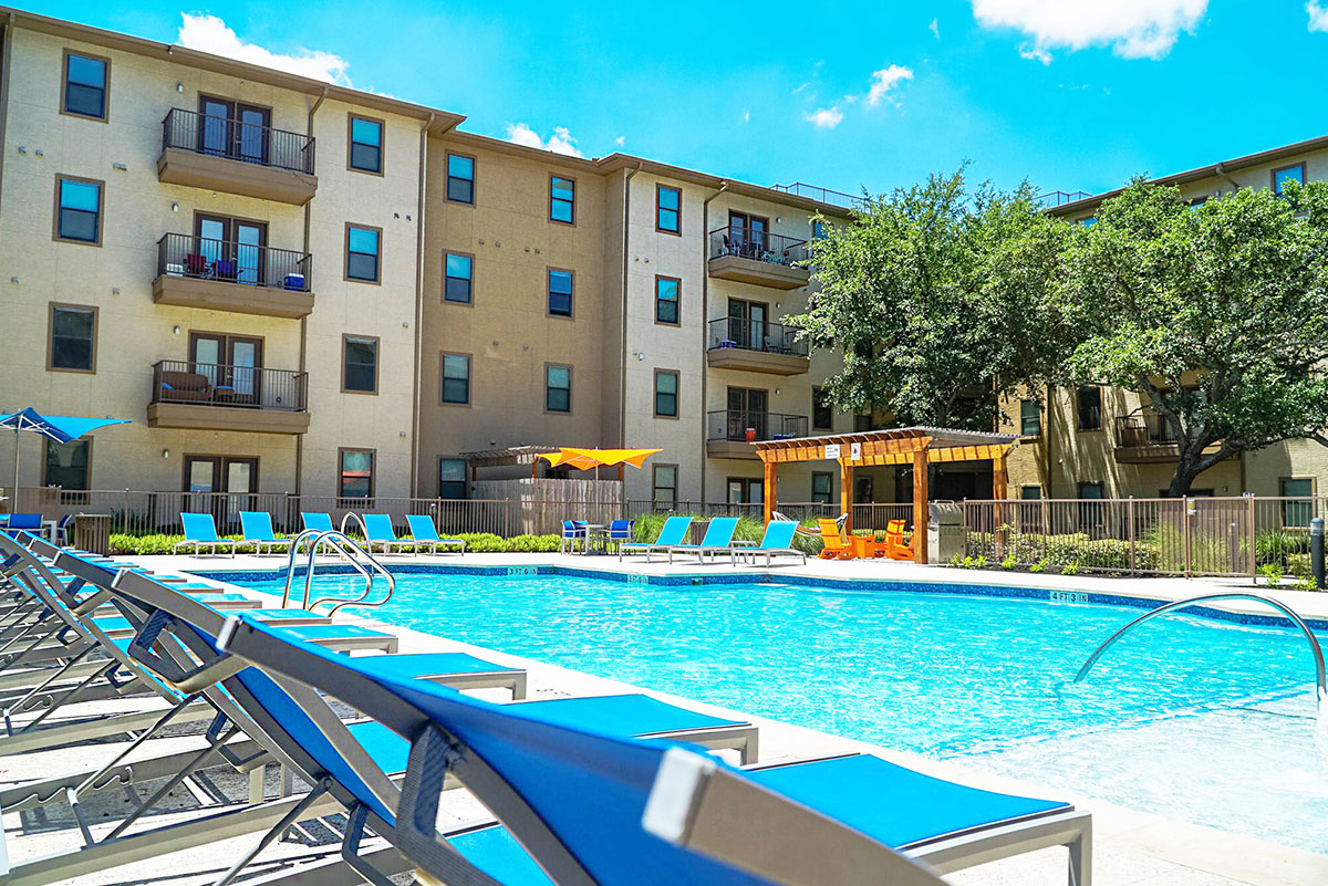 Pool view with apartment building