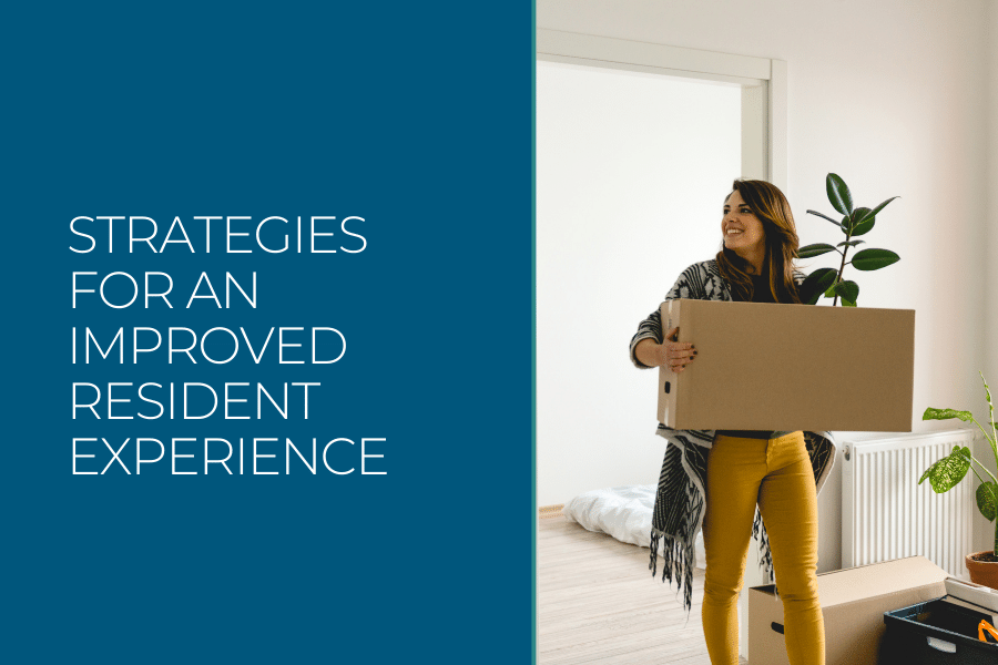 Strategies for an improved resident experience. A person smiling as they move a box into apartment.