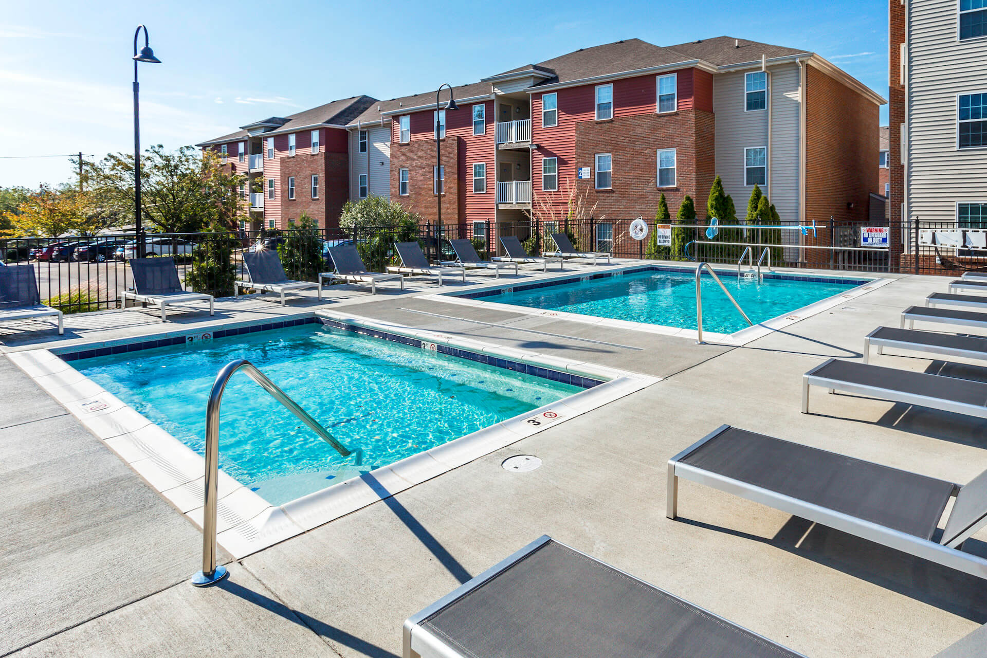 view of the outdoor pool at the stretch apartments