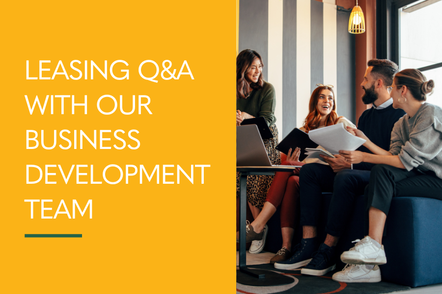 Leasing Q&A with our business development team, 4 co-workers working in open office space